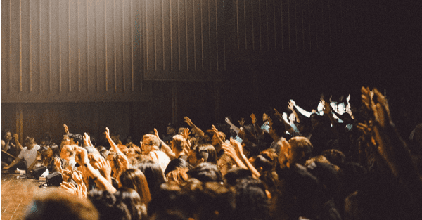 Audience raising their hands